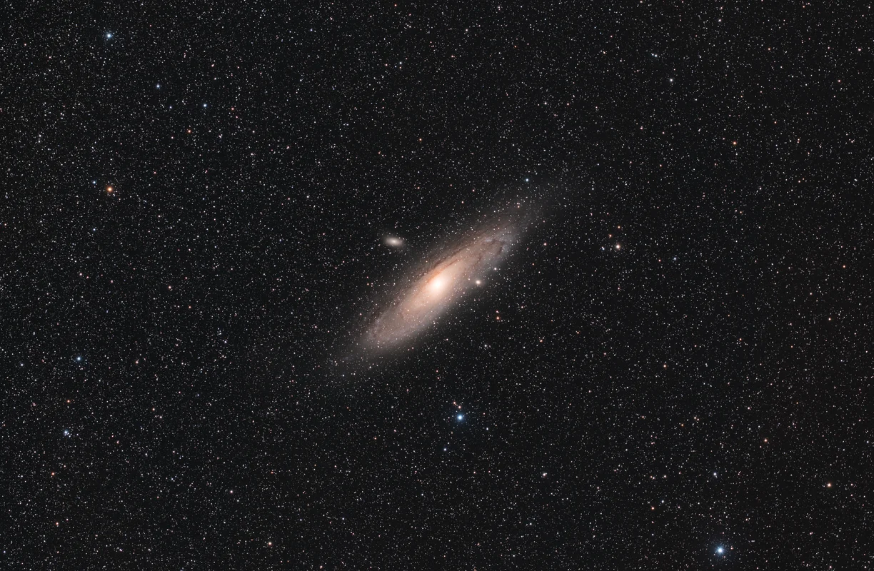 The Andromeda Galaxy captured as a widefield composition with detailed dust lanes and a bright central core.