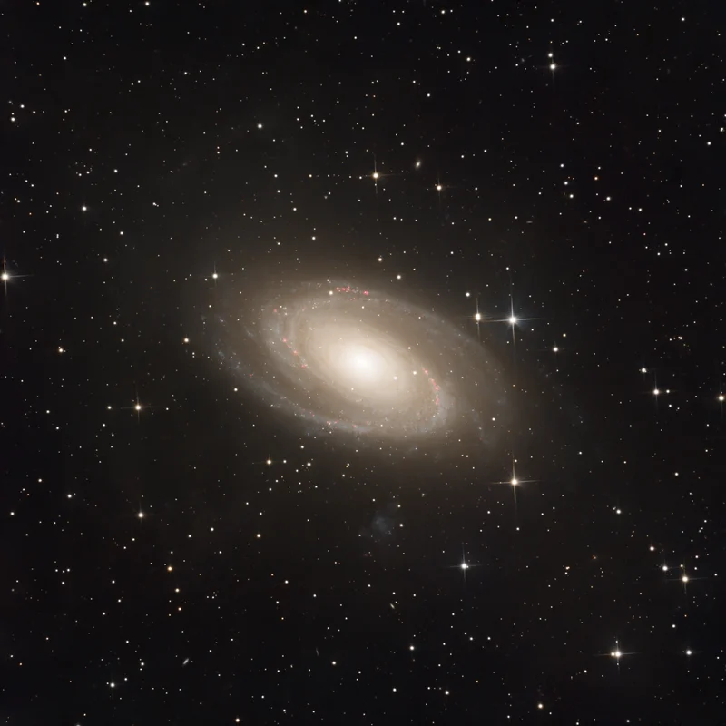 A grand spiral galaxy in Ursa Major, showing a bright core, layered spiral arms, and surrounding faint detail.